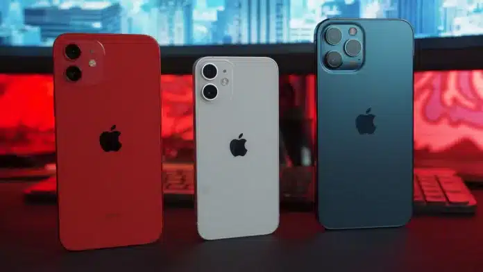 3 celulares iphone em cima da mesa