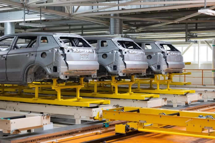 carros em processo de montagem